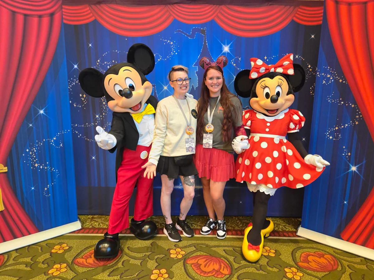 Advisors with Mickey and Minnie at a Disney event.