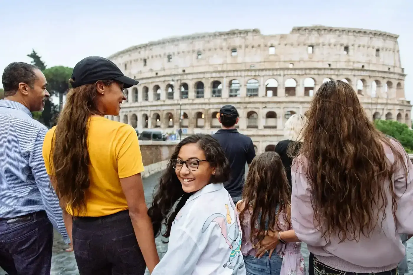 A family looking toward the Colosseum in Rome.