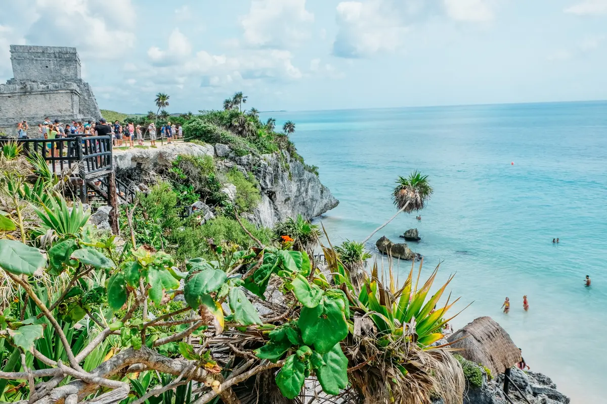 Mayan ruins on a rocky coast above a turquoise sea