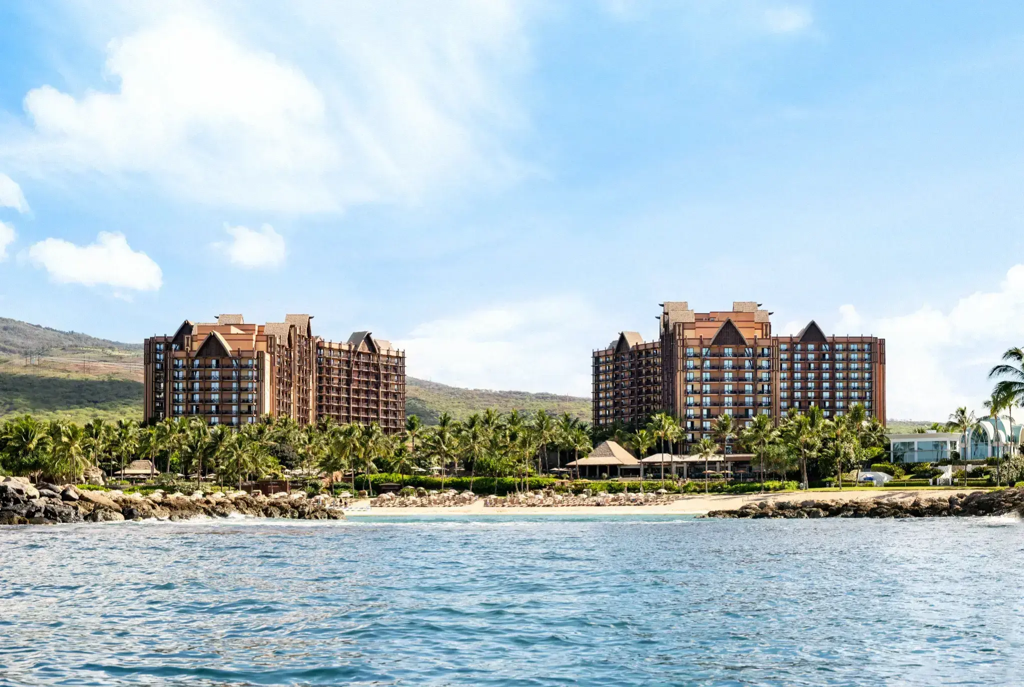 Aulani resort overlooking its beach and ocean lagoon.