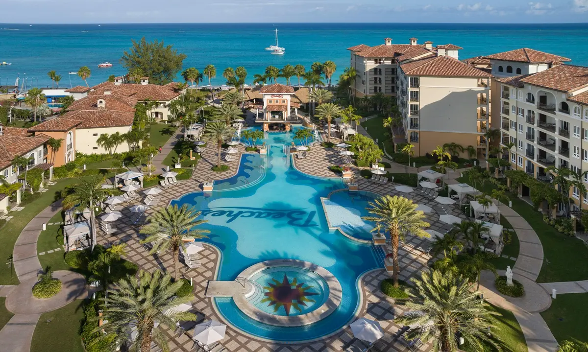 The Italian Village pool with the Caribbean Sea beyond at Beaches Turks & Caicos