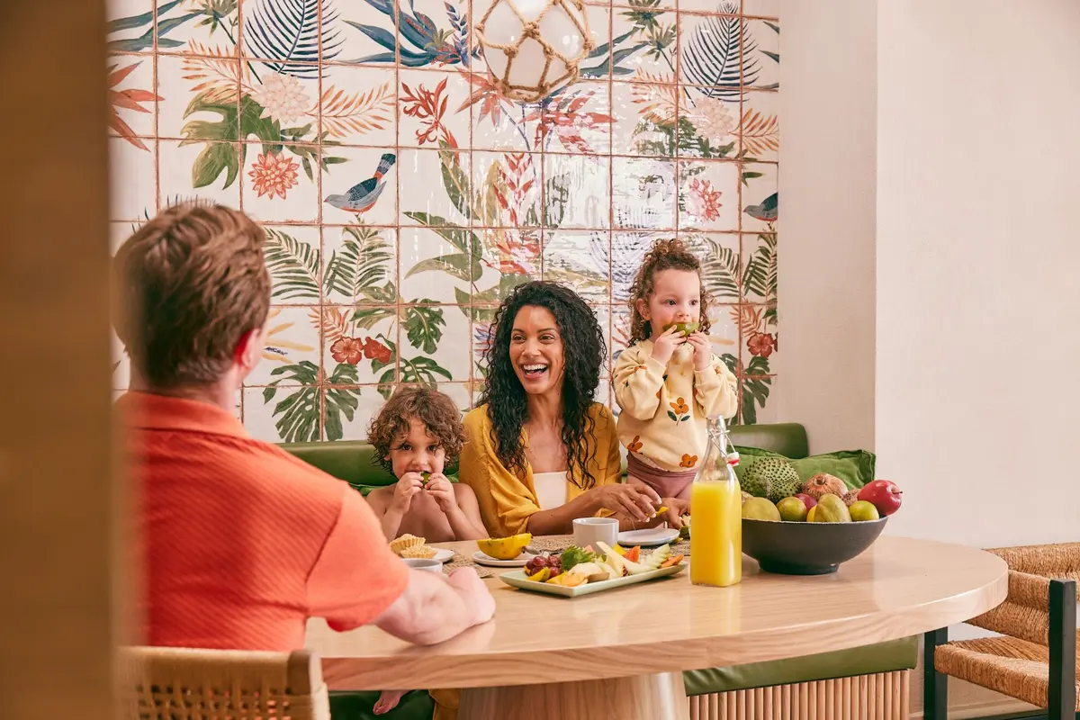 A family sharing breakfast and fresh fruit at Beaches Negril