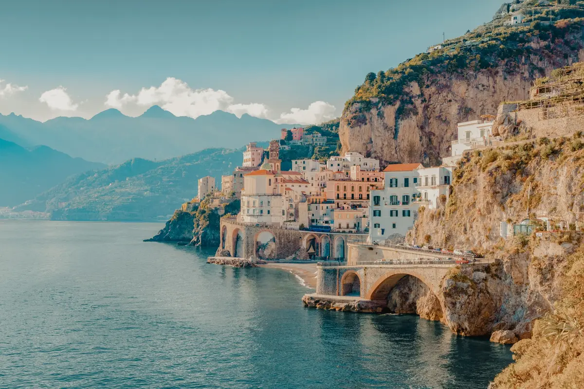 A Mediterranean village tucked between coastal cliffs and the sea