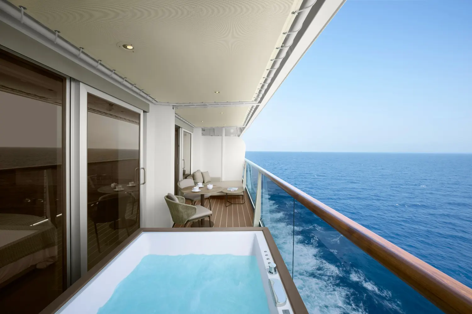 A spacious suite terrace with a private whirlpool overlooking the ocean