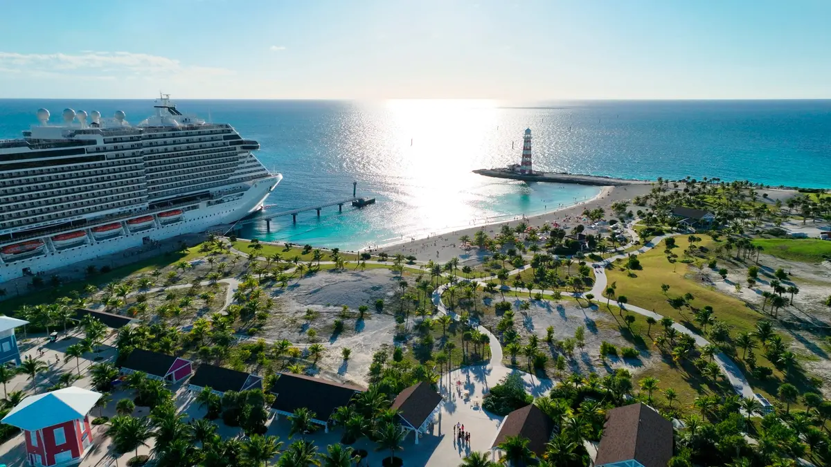 An MSC ship beside Ocean Cay’s beach and lighthouse