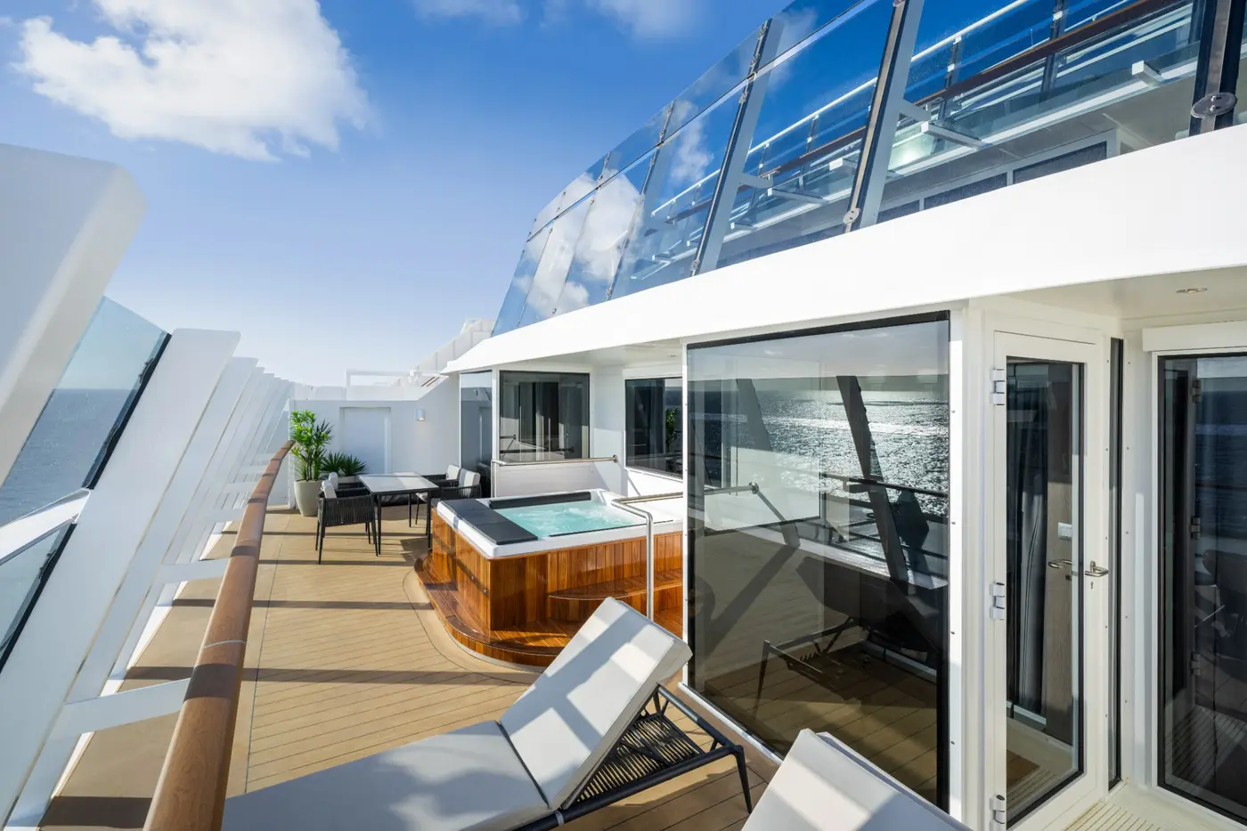 A spacious MSC suite terrace with loungers and a private whirlpool