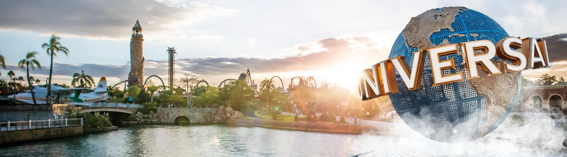 The Universal globe beside the waterfront at sunset.