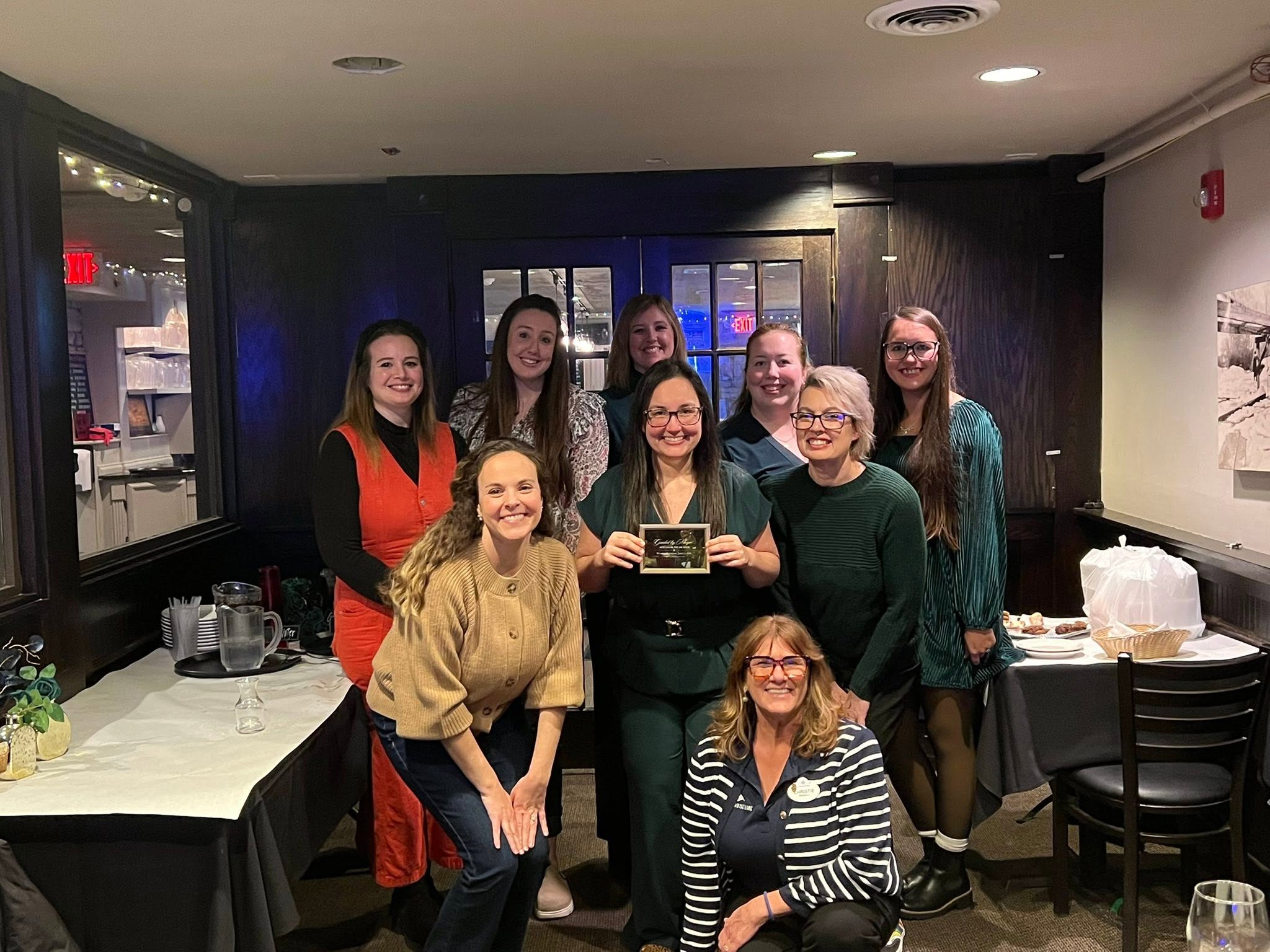 Wand & Compass team gathered together at an agency dinner