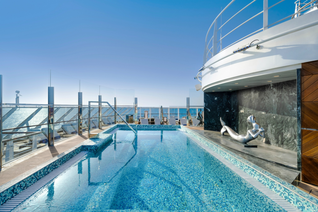 MSC Yacht Club pool with ocean views and surrounding deck.